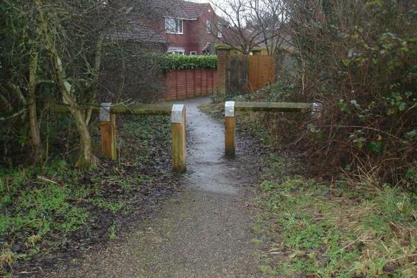 The photo for Barriers between cycle path and housing estate.